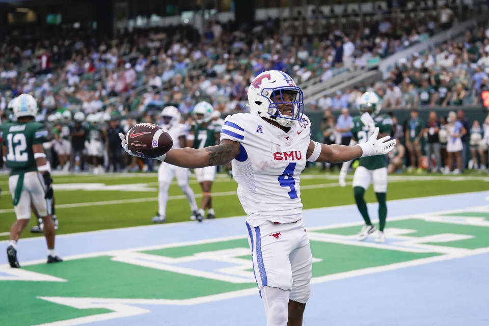 SMU running back Jaylan Knighton celebrates his touchdown carry during the first half of the American Athletic Conference Championship NCAA college football game against Tulane , Saturday, Dec. 2, 2023 in New Orleans. (AP Photo/Gerald Herbert)