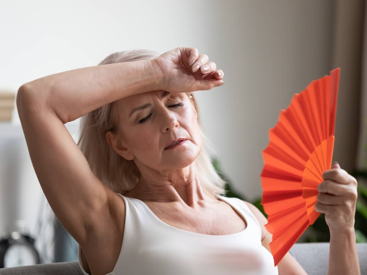 Hot flashes are a common symptom of perimenopause but there can be more than 30 others that emerge during this change. (Shutterstock / fizkes - image credit)