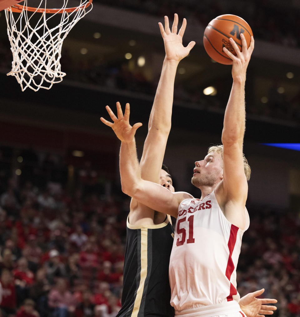 Nebraska's Rienk Mast, right, shoots against Purdue's Zach Edey during the first half of an NCAA college basketball game Tuesday, Jan. 9, 2024, in Lincoln, Neb. (AP Photo/Rebecca S. Gratz)