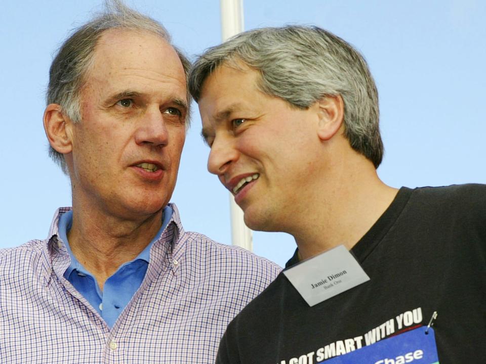 DALLAS - APRIL 7:  J.P. Morgan Chase chairman and CEO William Harrison (L) and Bank One chairman and CEO Jamie Dimon speak before the start of the J.P. Morgan Chase Corporate Challenge foot race April 7, 2004 in Dallas, Texas.  The two companies will merge later this year.  (Photo by Tim Sharp via Getty Images)