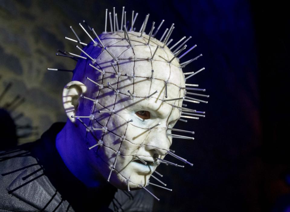 An actor poses in the medieval Frankenstein Castle about 35 kilometers (22 miles) south of Frankfurt, Germany Saturday, Oct. 26, 2019. The Medieval Frankenstein Castle has become a favorite haunt for Germans celebrating Halloween, a tradition that’s become increasingly popular in continental Europe in recent years. The crumbling castle, located about 35 kilometers (22 miles) south of Frankfurt, has been staging spooky festivals since 1977 featuring monsters, gore and spine-chilling live shows. (AP Photo/Michael Probst)