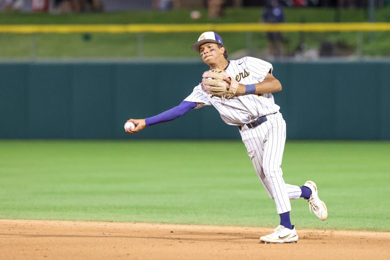 Mooresville's Liam Delp (4) grabs the infield grounder and makes a throw to 1st base during the IHSAA high school baseball Class 4A state final as the Lake Central Indians vs Mooresville Pioneers, Jun 15, 2024; Indianapolis, IN, USA; at Victory Field.