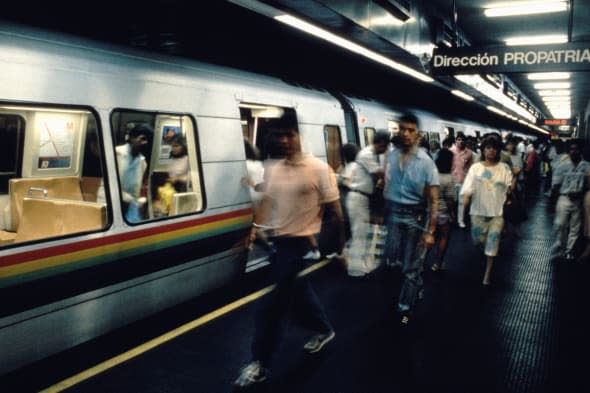 Passengers move along platform as they exit a train in Caracas Venezuela modern Metro system