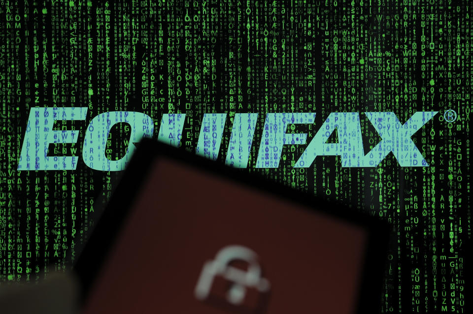 An Equifax logo is seen in this photo illustration on 20 October, 2017. The consumer credit reporting agency was hacked twice in 2017. In the last attack in July financial data belonging to over 145 million Americans was stolen including social security numbers, credit card numbers and addresses. (Photo by Jaap Arriens/NurPhoto via Getty Images)