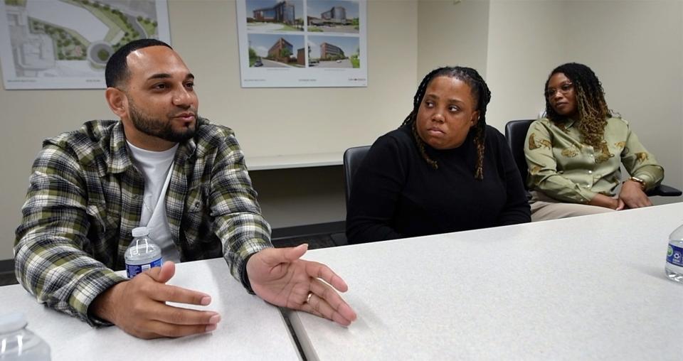 From the left, Luis Berrio describes his life that brought him to work with the Group Violence Initiative while Tiff Lowe and Kiuana Henderson look on.