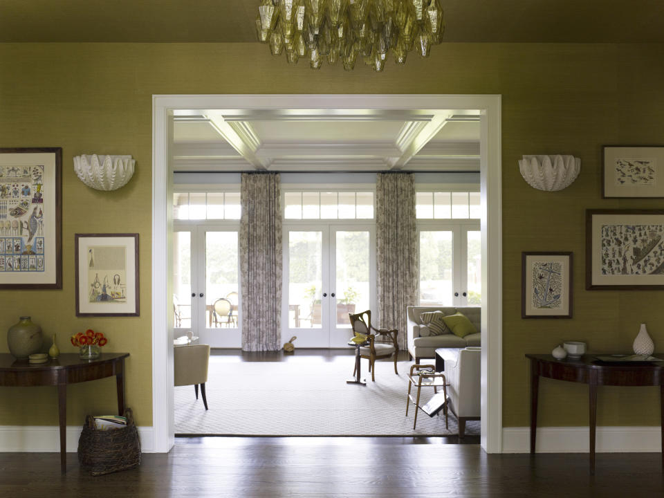 This image provided by Mendelson Group shows designer Gideon Mendelson's Sagaponack, New York, home. The pair of vintage French plaster shell sconces "still feel fresh and relevant toda," he says, an example of a trend toward meaningful and sustainable "slow decorating." (Eric Piasecki/OTTO via AP)