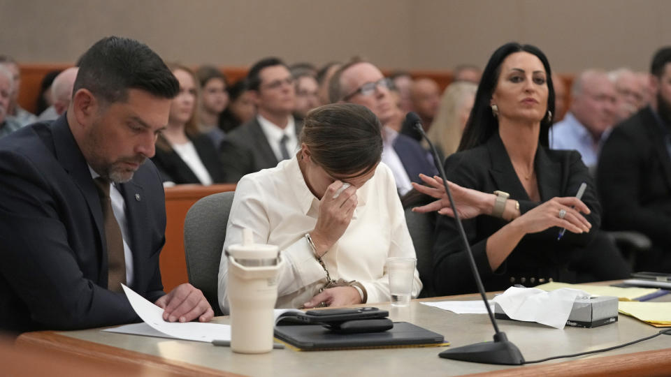 Kouri Richins, a Utah mother of three who authorities say fatally poisoned her husband then wrote a children's book about grieving, cries during a bail hearing Monday, June 12, 2023, in Park City, Utah. A judge ruled to keep her in custody for the duration of her trial. (AP Photo/Rick Bowmer, Pool)
