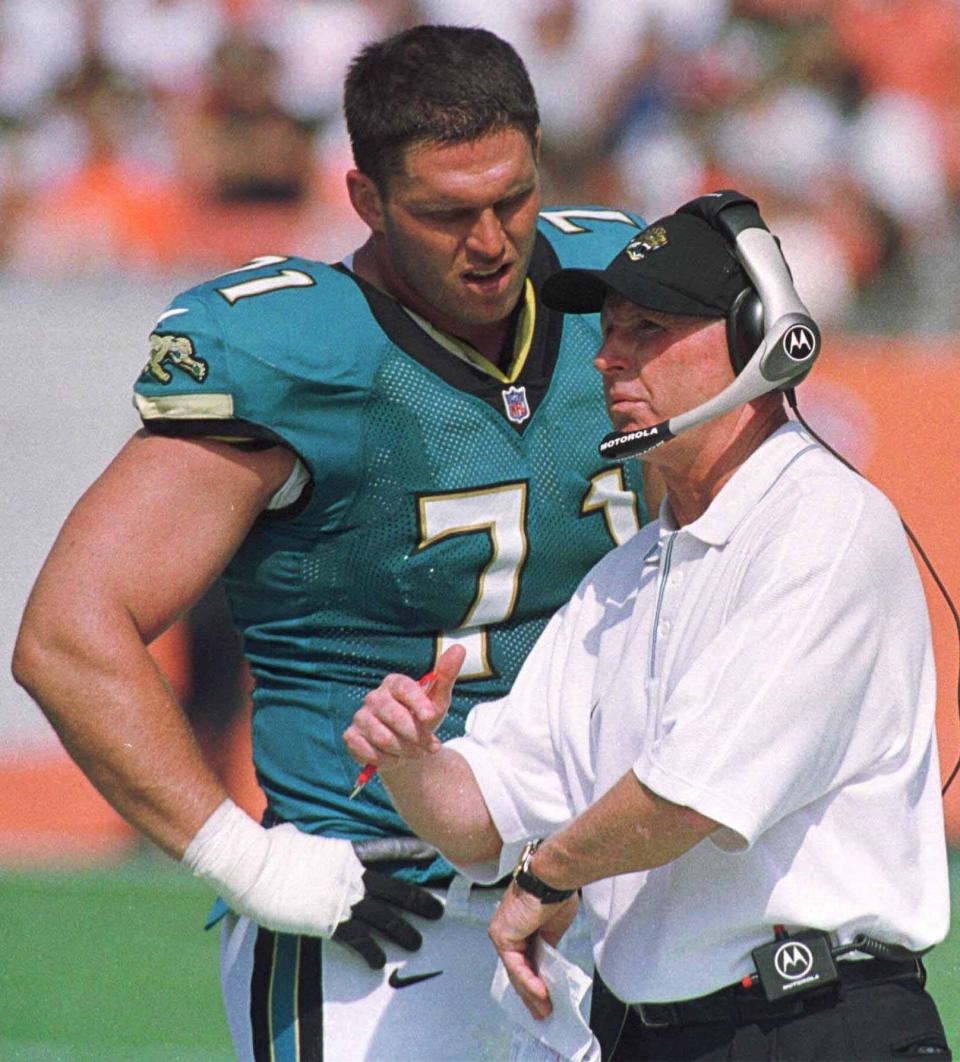 Jacksonville Jaguars tackle Tony Boselli talks with head coach Tom Coughlin on the sidelines during the team's 27-7 win over the Browns in Cleveland, Sept. 3, 2000.