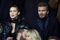 <p>The model and Posh’s hubby found themselves sitting next to each other – no doubt in a V.I.P. area – at the UEFA Champions League Round of 16 Second Leg match between Paris Saint-Germain and Real Madrid in Paris, France on Tuesday. The new friends shook hands and chatted throughout the game. (Photo: Manuel Queimadelos Alonso/Getty Images ) </p>