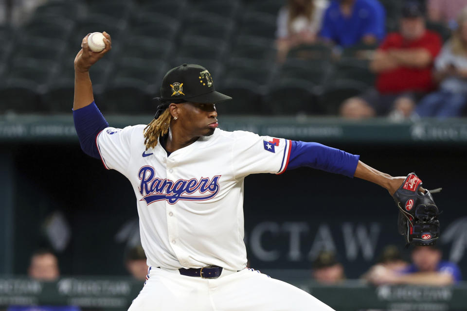 Texas Rangers starting pitcher Jose Urena delivers against the Los Angeles Angels in the first inning of a baseball game Saturday, May 18, 2024, in Arlington, Texas. (AP Photo/Richard W. Rodriguez)