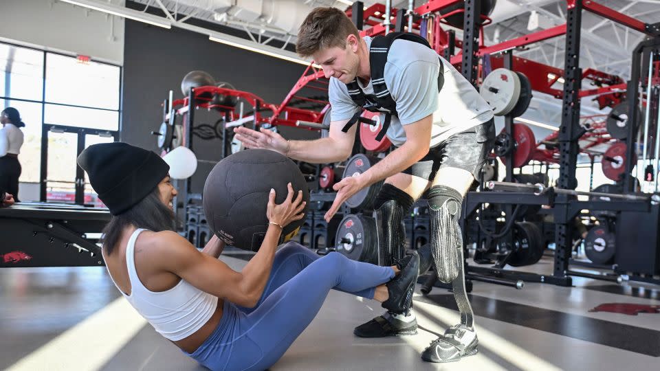 Davis-Woodhall trains with her husband, Paralympian Hunter Woodall. - Michael Woods/AP