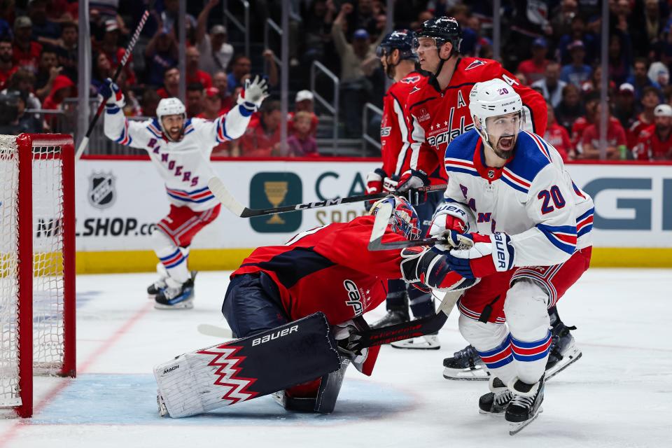 WASHINGTON, DC - APRIL 28: Chris Kreider #20 and Vincent Trocheck #16 of the New York Rangers celebrate after Artemi Panarin #10 scores the go ahead goal against Charlie Lindgren #79 of the Washington Capitals during the third period in Game Four of the First Round of the 2024 Stanley Cup Playoffs at Capital One Arena on April 28, 2024 in Washington, DC.