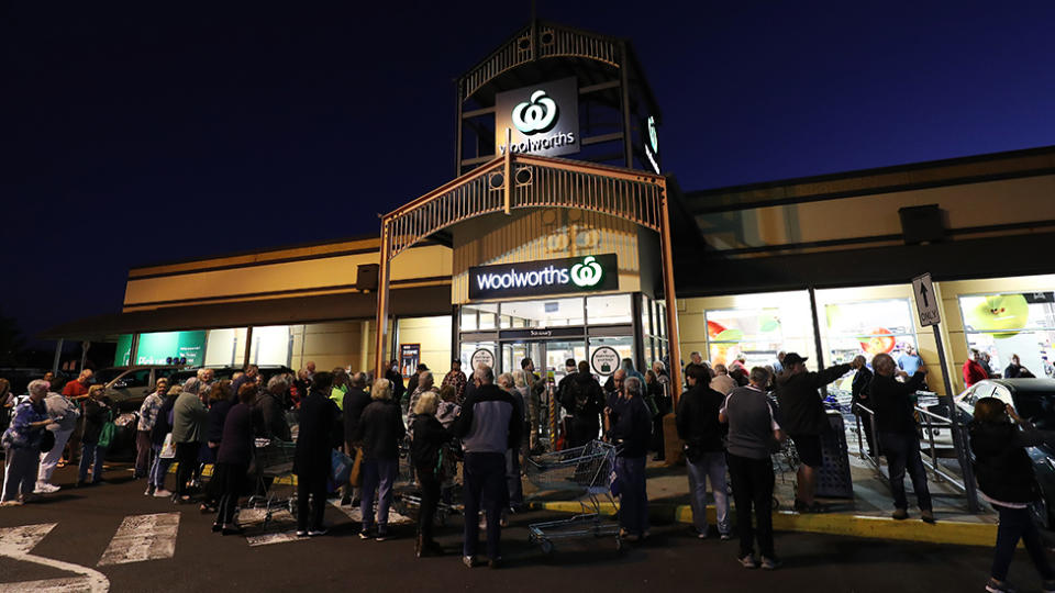 General view outside a Woolworths in Sunbury as people wait outside on March 17, 2020 in Various Cities, Australia. Australian supermarket chains have announced special shopping hours for the elderly and people with disabilities