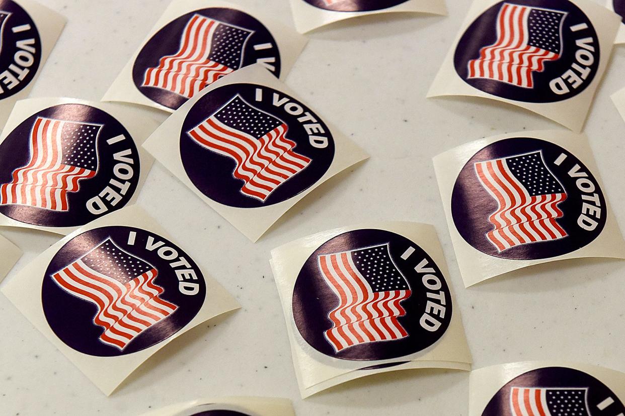"I voted" stickers await voters Tuesday after they cast their ballot in the ballot counting machine at precinct 18 and 19 at the University of Missouri Extension Office at 1012 N. Highway UU.