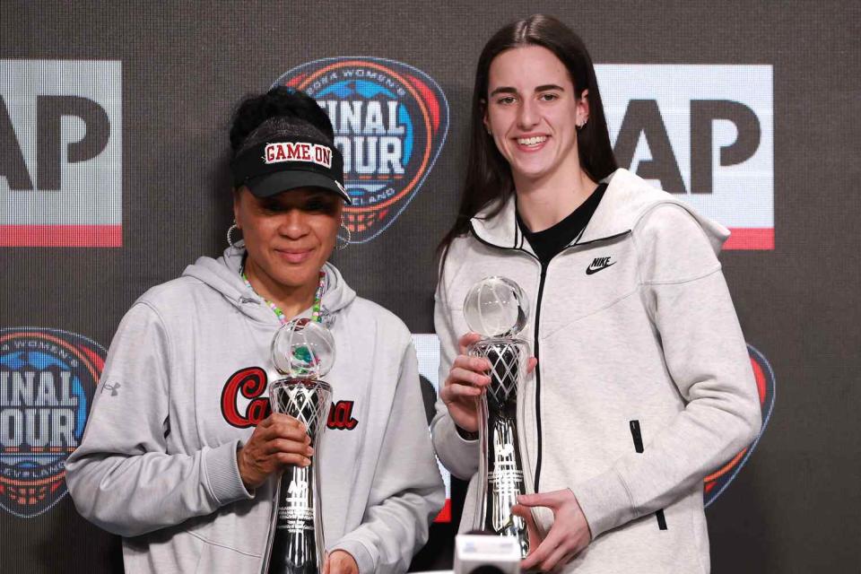 <p>Gregory Shamus/Getty </p>  AP Coach of the Year Dawn Staley and AP Player of the Year Caitlin Clark #22 of the Iowa Hawkeyes 