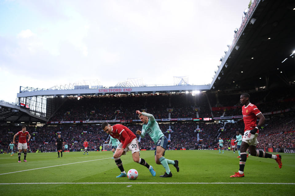 MANCHESTER, ENGLAND - APRIL 02: Diogo Dalot of Manchester United battles for possession with Kiernan Dewsbury-Hall of Leicester City during the Premier League match between Manchester United and Leicester City at Old Trafford on April 02, 2022 in Manchester, England. (Photo by Laurence Griffiths/Getty Images)