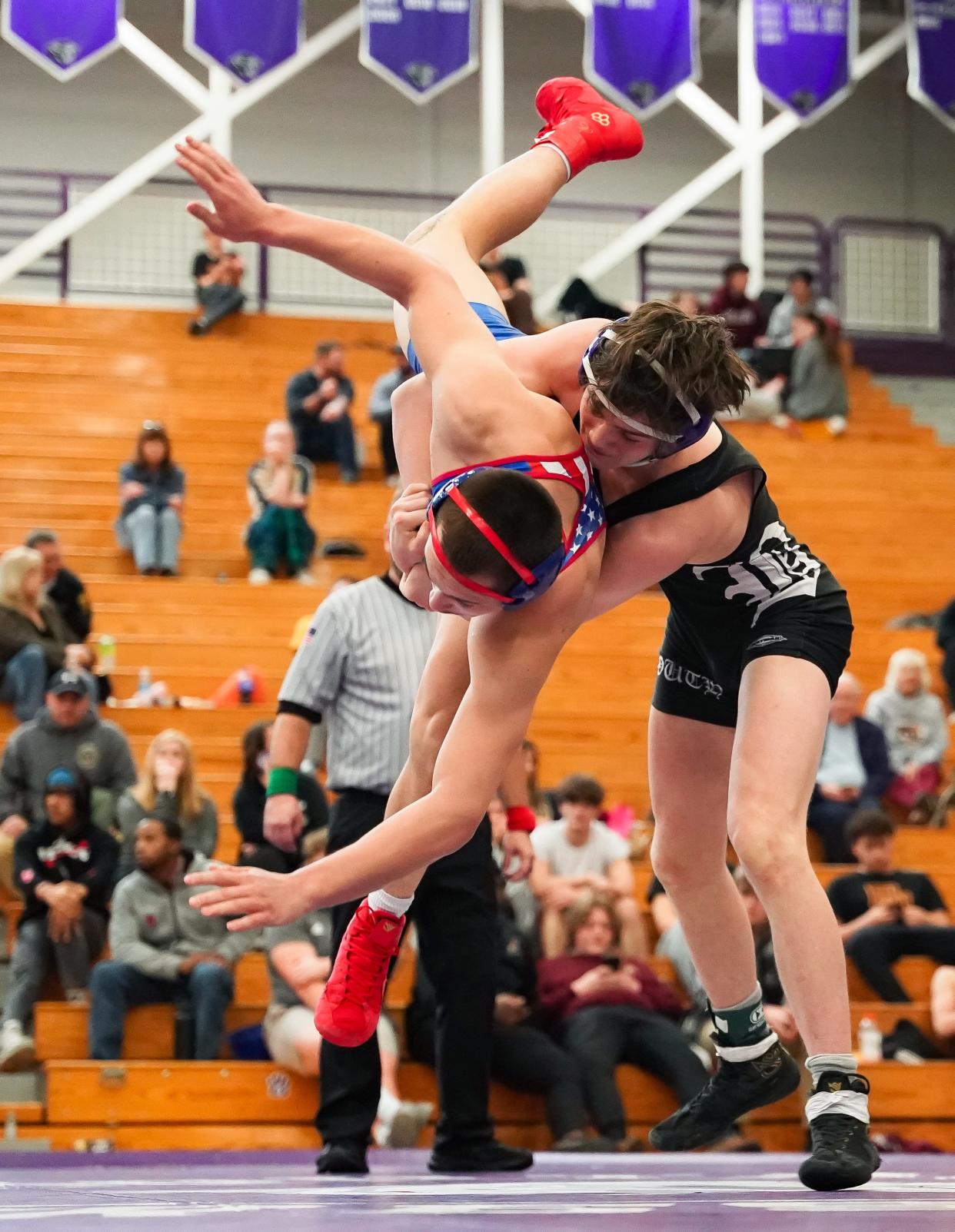 Bloomington South’s Wyatt Cooksey (right) wrestles against Owen Valley’s Branson Weaver in the 144 pound final during the IHSAA wrestling regional at Bloomington South on Saturday, Feb. 3, 2024.