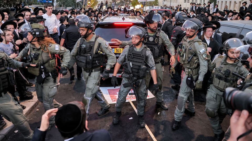 Israeli security forces deploy in Jerusalem's Mea Sharim neighborhood on Saturday ahead of a protest by ultra-Orthodox men. - Ahmad Gharabli/AFP/Getty Images