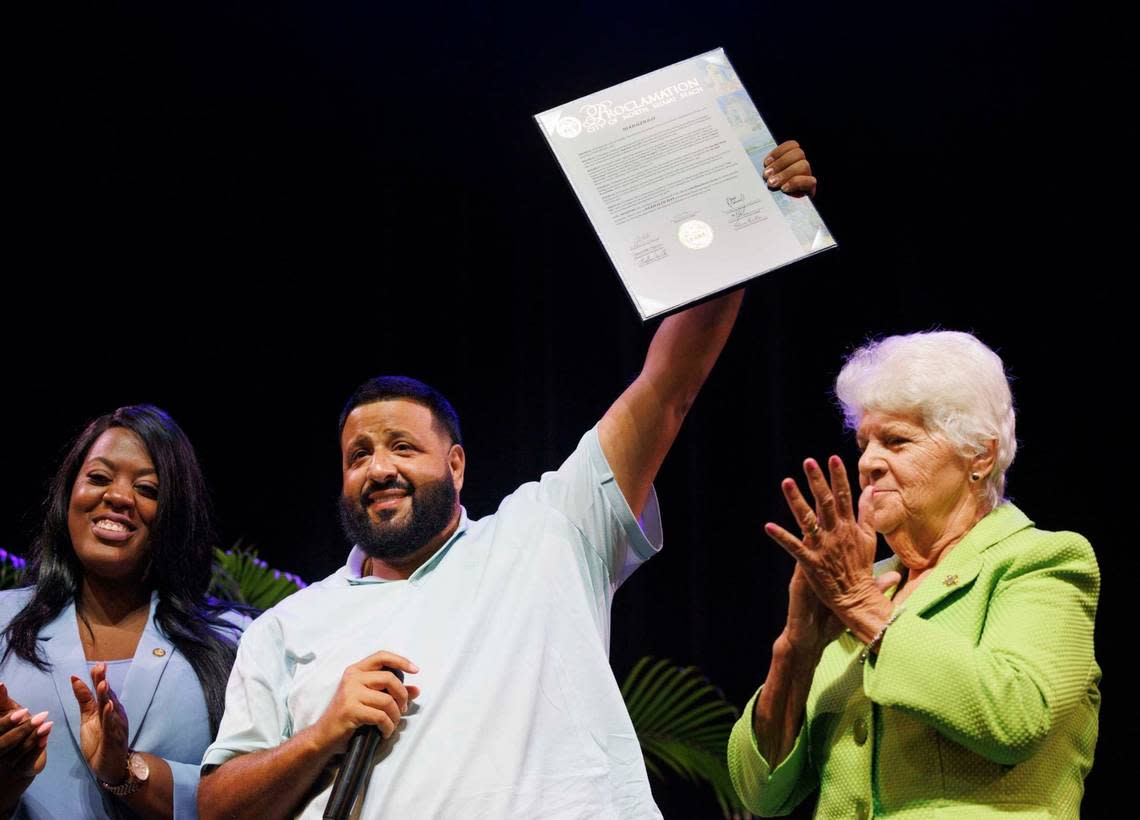 DJ Khaled, center, holds up a proclamation given to him by the mayor and Commissioners Daniela Jean, left, and Phyllis Smith, right, making May 8 DJ Khaled Day during the opening remarks of the NMB Small Business Expo on Wednesday, May 8, 2024, at North Miami Beach City Hall. The city presented DJ Khaled with the proclamation for his contributions to the local community and his efforts to give back.