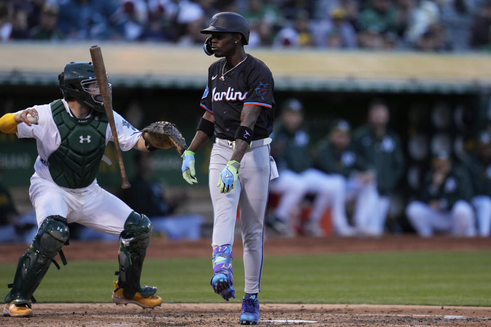 Miami Marlins' Jazz Chisholm Jr., right, reacts after striking out against Oakland Athletics pitcher JP Sears during the fourth inning of a baseball game Friday, May 3, 2024, in Oakland, Calif. (AP Photo/Godofredo A. Vásquez)