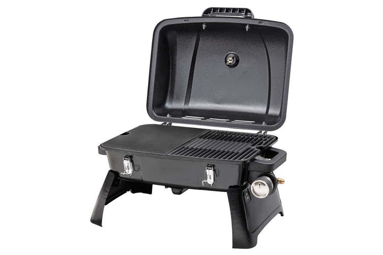 A black Gasmate Voyager Ultra-Portable Camping Gas BBQ has a lift-up lid, a solid plate and a separate grill. It has side stands and clips to close it.