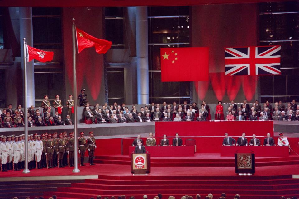 Chinese President Jiang Zemin addresses delegates following the raising of the Chinese and Hong Kong SAR flags during the handover ceremony at the Hong Kong Convention and Hexhibition Centre on July 1st, 1997. The event marks the end of 156 years of British colonial rule over the territory. (Photo by Torsten BLACKWOOD / AFP) (Photo by TORSTEN BLACKWOOD/AFP via Getty Images)