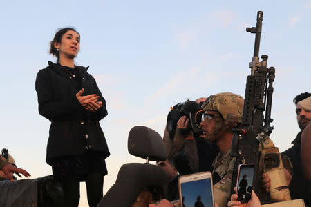 Nobel Peace Prize laureate, Yazidi activist Nadia Murad gestures while talking to people during her visit to Sinjar, Iraq December 14, 2018. REUTERS/Ari Jalal