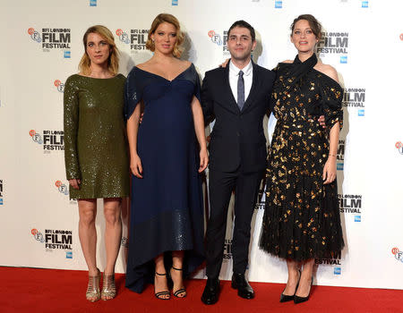 Marion Cotillard (R) poses with Lea Seydoux (2L), producer Nancy Grant (L) and director Xavier Dolan as they arrive for the gala screening of the film "Its only the end of the world" , during the 60th British Film Institute (BFI) London Film Festival at Leicester Square in London, Britain October 14, 2016. REUTERS/Hannah McKay