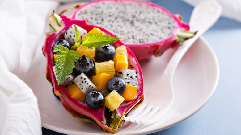 Fruit inside hollowed out dragon fruit skin