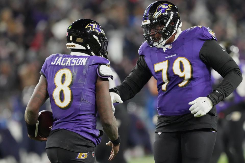 Jan 20, 2024; Baltimore, MD, USA; Baltimore Ravens quarterback Lamar Jackson (8) celebrates with offensive tackle Ronnie Stanley (79) after scoring a touchdown against the Houston Texans during the third quarter of a 2024 AFC divisional round game at M&T Bank Stadium. Mandatory Credit: Mitch Stringer-USA TODAY Sports