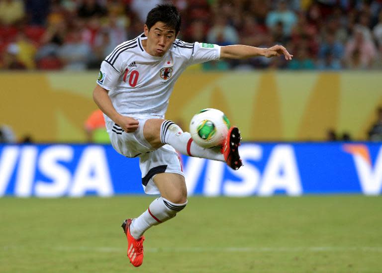 Japan's midfielder Shinji Kagawa controls the ball during a Confederations Cup Brazil 2013 Group A football match against Italy, on June 19, 2013