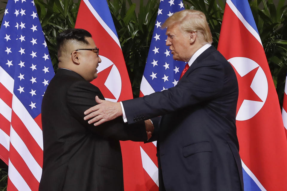 FILE - In this June 12, 2018, file photo, U.S. President Donald Trump, right, shakes hands with North Korea leader Kim Jong Un at the Capella resort on Sentosa Island in Singapore. U.S. Secretary of State Mike Pompeo downplayed the possibility of another summit between President Donald Trump and North Korean leader Kim Jong Un before the U.S. presidential election, saying Trump would only want to engage if there were real prospects of progress. (AP Photo/Evan Vucci, File)