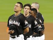 <p>Miami Marlins Giancarlo Stanton, Christian Yelich, Dee Gordon and Justin Bour paid tribute on the field to pitcher Jose Fernandez, who died on a boat accident Sunday morning, before their game against the New York Mets on Monday, Sept. 26, 2016 at Marlins Park in Miami, Fla. (Pedro Portal/Miami Herald/TNS via Getty Images) </p>