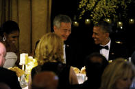 U.S. President Barack Obama and first lady Michelle Obama host a state dinner for Singapore Prime Minister Lee Hsien Loong and his wife Mrs. Lee Hsien Loong to the White House in Washington U.S., August 2, 2016. REUTERS/Mary F. Calvert