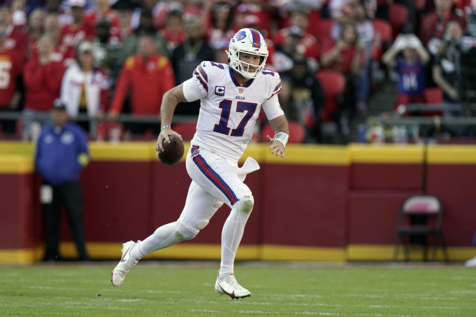 Buffalo Bills quarterback Josh Allen scrambles during the first half of an NFL football game against the Kansas City Chiefs Sunday, Oct. 16, 2022, in Kansas City, Mo. (AP Photo/Charlie Riedel)