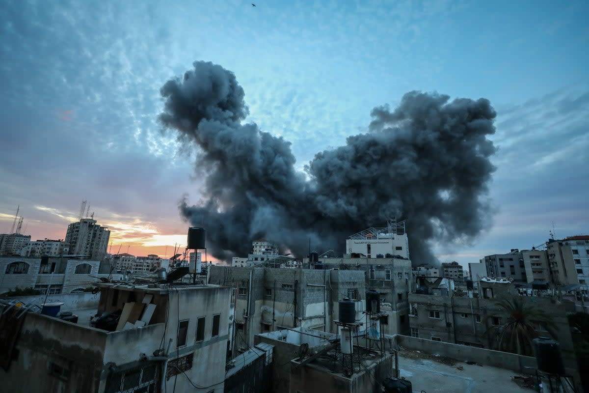 A ball of smoke rises from an explosion on a Palestinian tower following an Israeli airstrike in Gaza City (APAImages/Shutterstock)