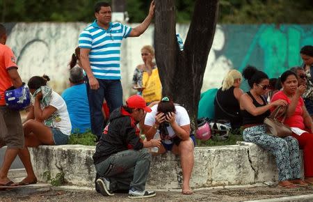 Relatives of prisoners await news in front of the Medical Legal Institute (IML) after the end of a bloody prison riot in the Amazon jungle city of Manaus, Brazil January 2, 2017. REUTERS/Michael Dantas