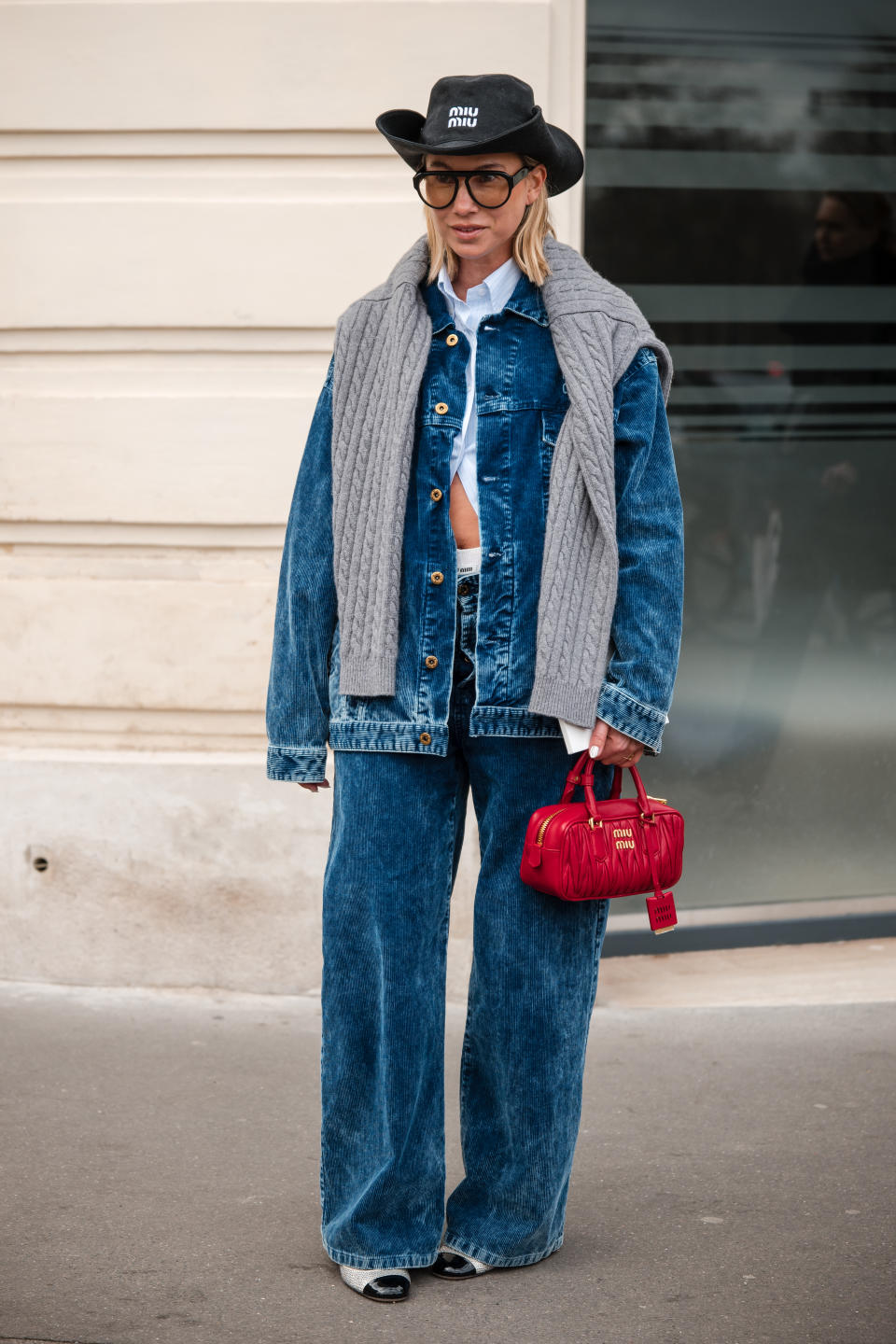 A woman at Paris Fashion Week wearing a Canadian Tuxedo like Bella Hadid's