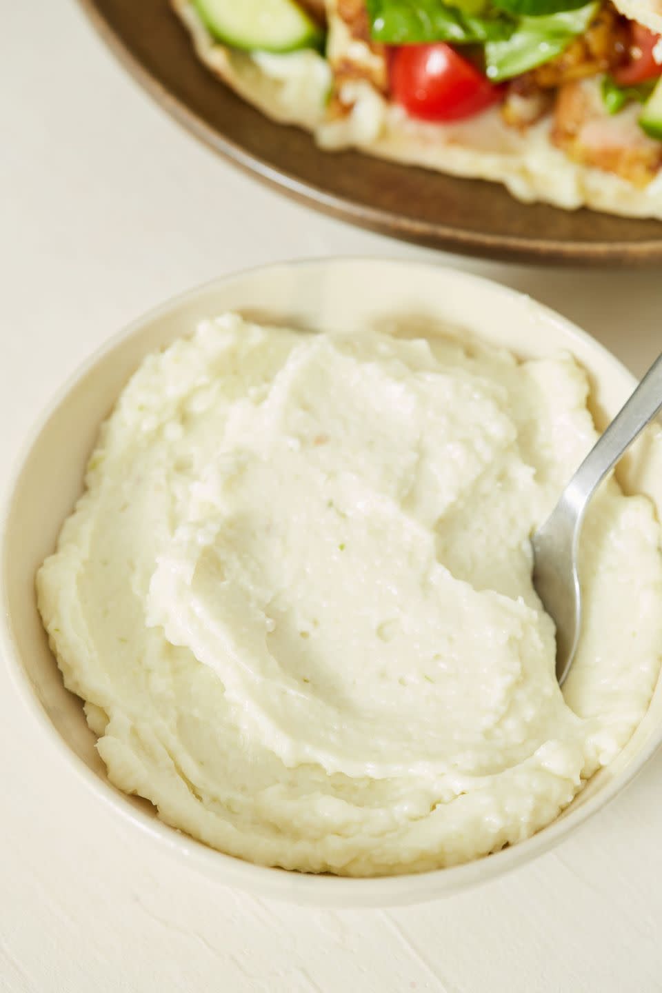 <p>Garlic lovers, this is the condiment of your dreams. Toum is essentially <a href="https://www.delish.com/cooking/recipe-ideas/a35702019/garlic-aioli-recipe/" rel="nofollow noopener" target="_blank" data-ylk="slk:aioli;elm:context_link;itc:0;sec:content-canvas" class="link ">aioli</a>, but with garlic instead of egg. This makes it the perfect creamy addition to any vegan sandwich, but watch out—this stuff is POWERFUL (so only use a little).</p><p>Get the <strong><a href="https://www.delish.com/cooking/recipe-ideas/a35048197/toum-recipe/" rel="nofollow noopener" target="_blank" data-ylk="slk:Toum recipe;elm:context_link;itc:0;sec:content-canvas" class="link ">Toum recipe</a></strong>.</p>