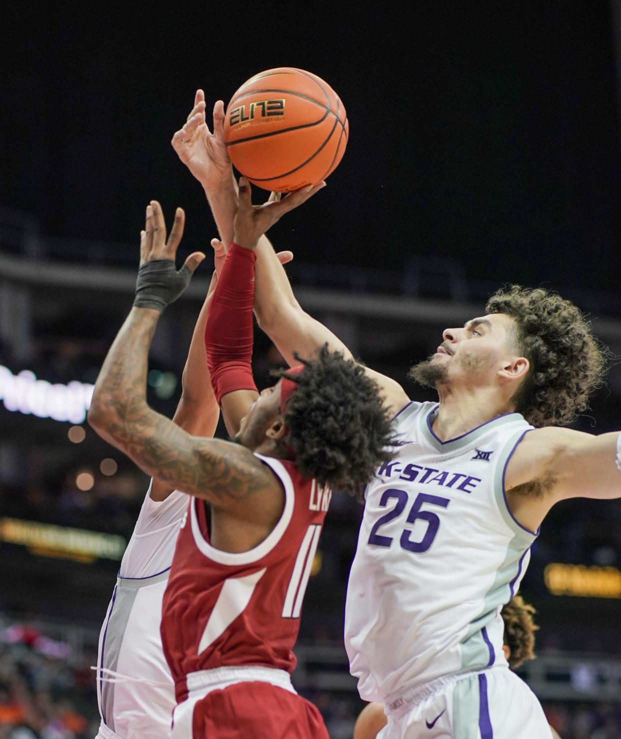 Kansas State forward Ismael Massoud (25) defends against Arkansas' Chris Lykes (11) during Monday's Hall of Fame Classic game at T-Mobile Center in Kansas City, Mo.