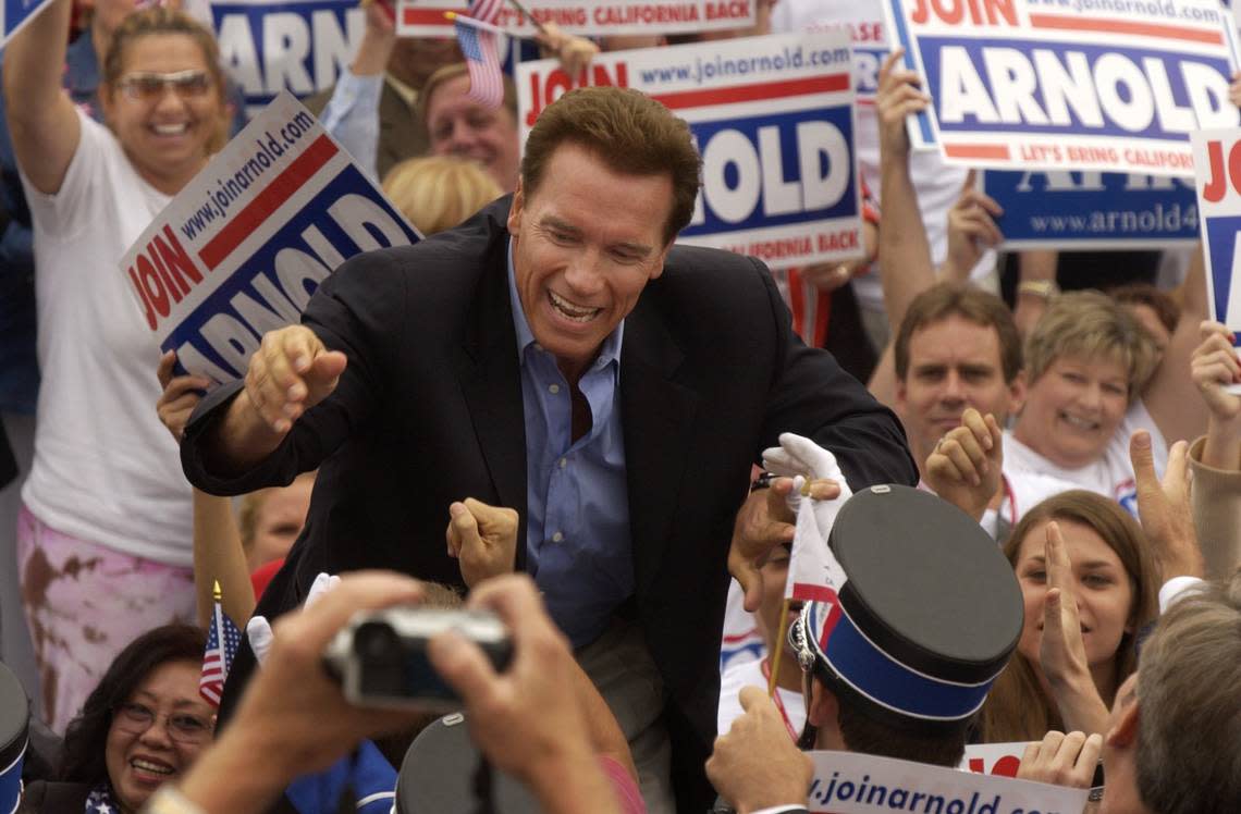 Gubernatorial candidate Arnold Schwarzenegger greets supporters during a campaign rally outside of the Republican state convention in Los Angeles on Sept. 13, 2003. John Decker/Sacramento Bee file