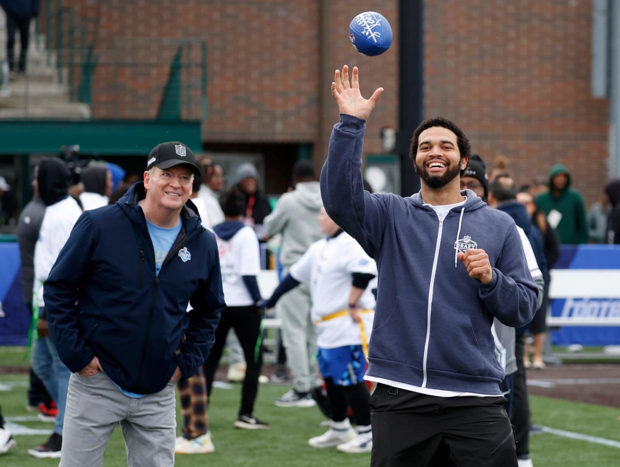 NFL commissioner Roger Goodell watches USC quarterback Caleb Williams, who is expected to be the first pick in this year's NFL draft, catch the football while throwing to Detroit-area Special Olympics athletes during the NFL Play Football Prospect Clinic with Special Olympics athletes and 13 of the 2024 NFL draft prospects at the Corner Ballpark in Detroit on Wednesday, April 24, 2024.