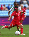 COVENTRY, ENGLAND - JULY 28: Desiree Scott of Canada passes the ball during the Women's Football first round Group F Match of the London 2012 Olympic Games between Canada and South Africa, at City of Coventry Stadium on July 28, 2012 in Coventry, England. (Photo by Quinn Rooney/Getty Images)