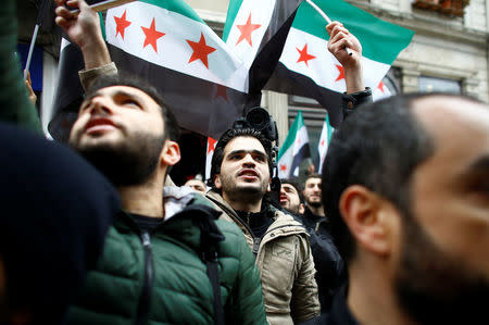 Syrians living in Istanbul gather in front of the Russian Consulate during a protest in Istanbul, Turkey February 22, 2018. REUTERS/Osman Orsal