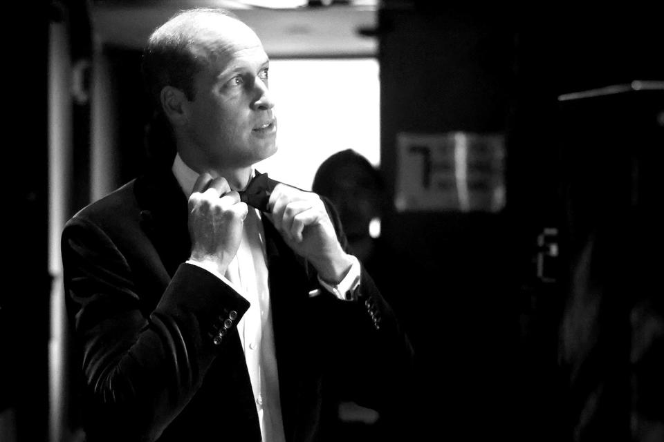 <p>Chris Jackson/Getty Images for Earthshot</p> Prince William adjusts his bowtie backstage at the Earthshot Prize award ceremony 