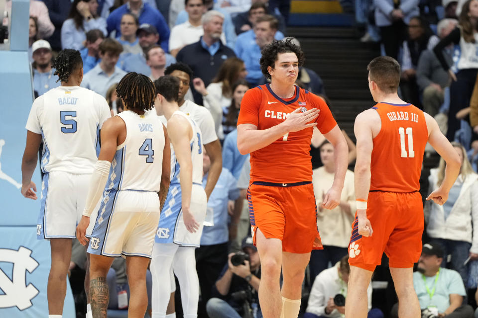 Feb. 6, 2024; Chapel Hill, North Carolina; Clemson Tigers forward Ian Schieffelin (4) reacts with guard Joseph Girard III (11) in the second half at Dean E. Smith Center. Bob Donnan-USA TODAY Sports