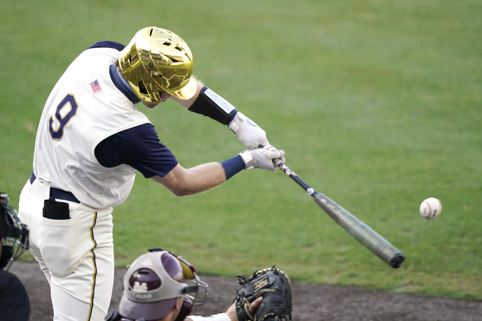 Notre Dame's Jack Brannigan (9) reaches out to hit a Mississippi State pitch during an NCAA college baseball super regional game, Monday, June 14, 2021, in Starkville, Miss. (AP Photo/Rogelio V. Solis)