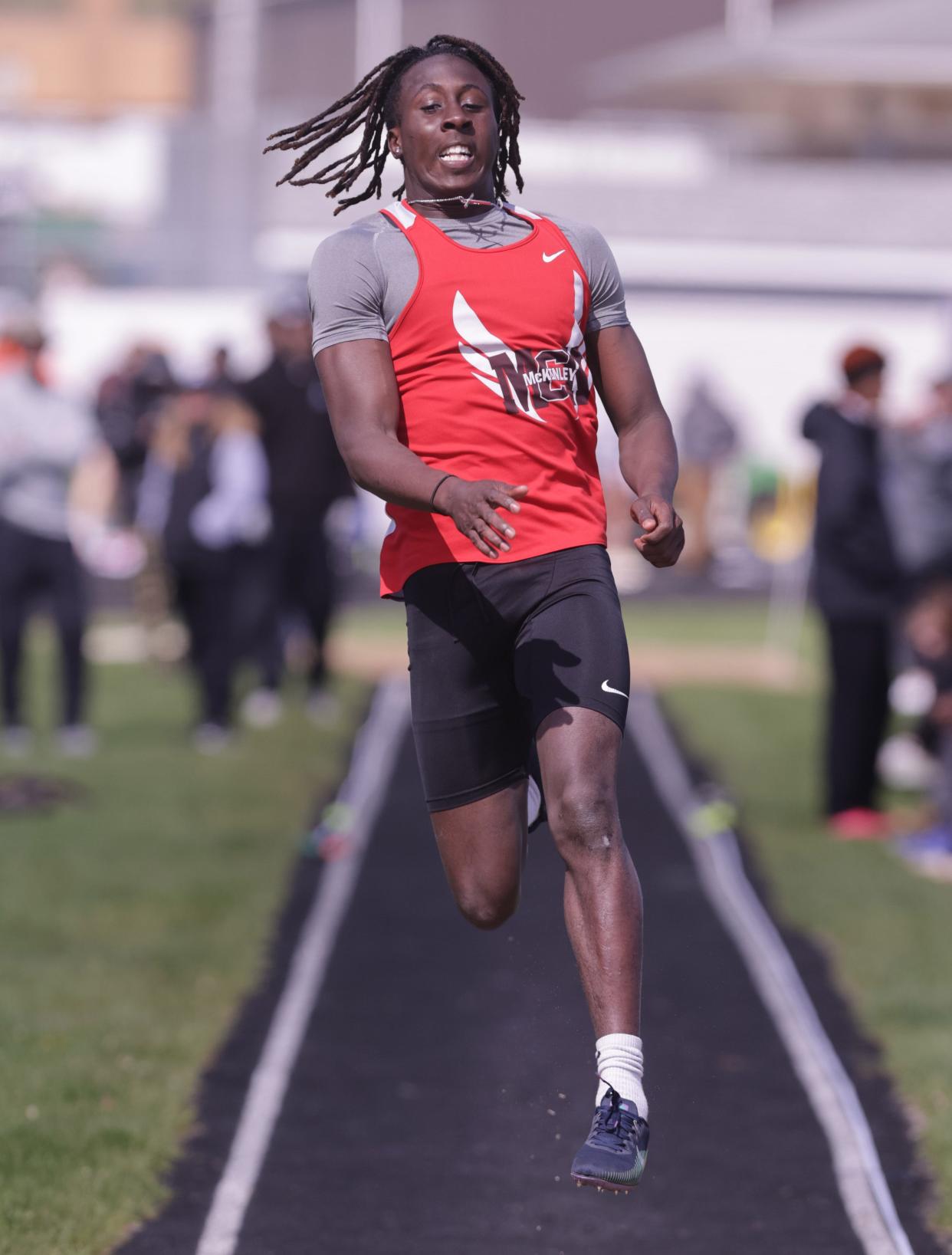 Canton South's Julius Kimbrough competes in the long jump at Saturday's Stark County Track and Field Championships.