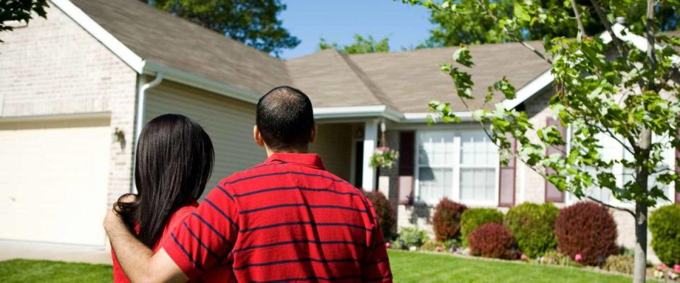 Extensive series of a Caucasian Real Estate Agent and African-American Couple in front of a home.