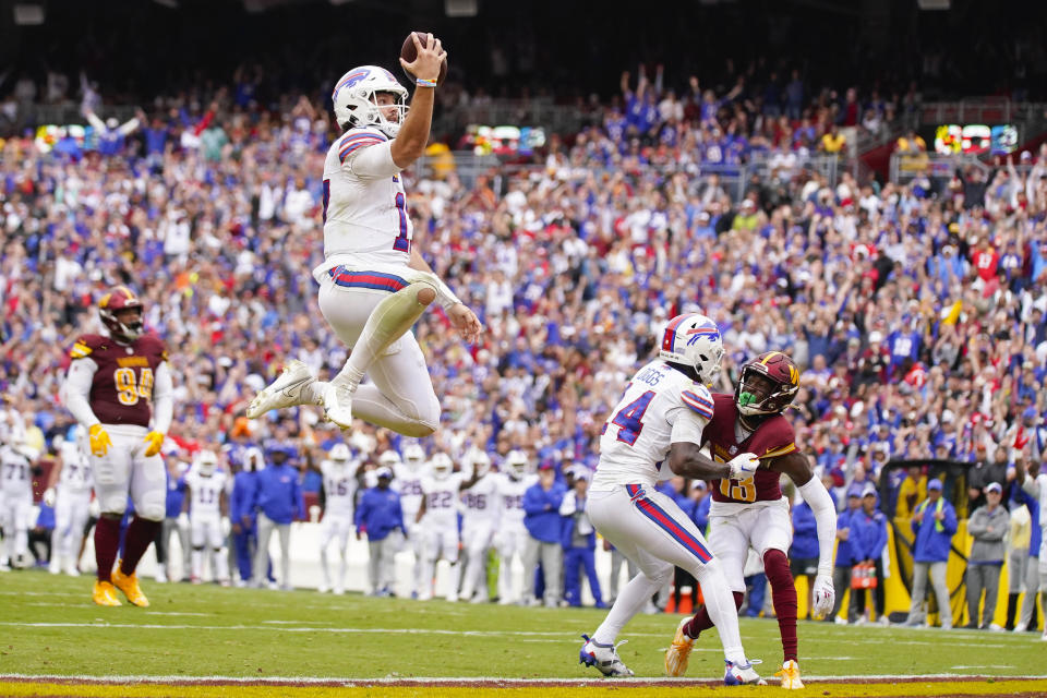 Buffalo Bills quarterback Josh Allen (17) leaping into the endzone as he scores a touchdown against the Washington Commanders during the second half of an NFL football game, Sunday, Sept. 24, 2023, in Landover, Md. (AP Photo/Evan Vucci)